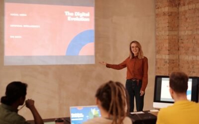 a woman standing in front of a projector screen