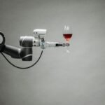 a robotic arm holding a glass of wine