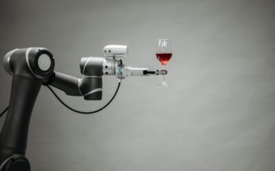 a robotic arm holding a glass of wine